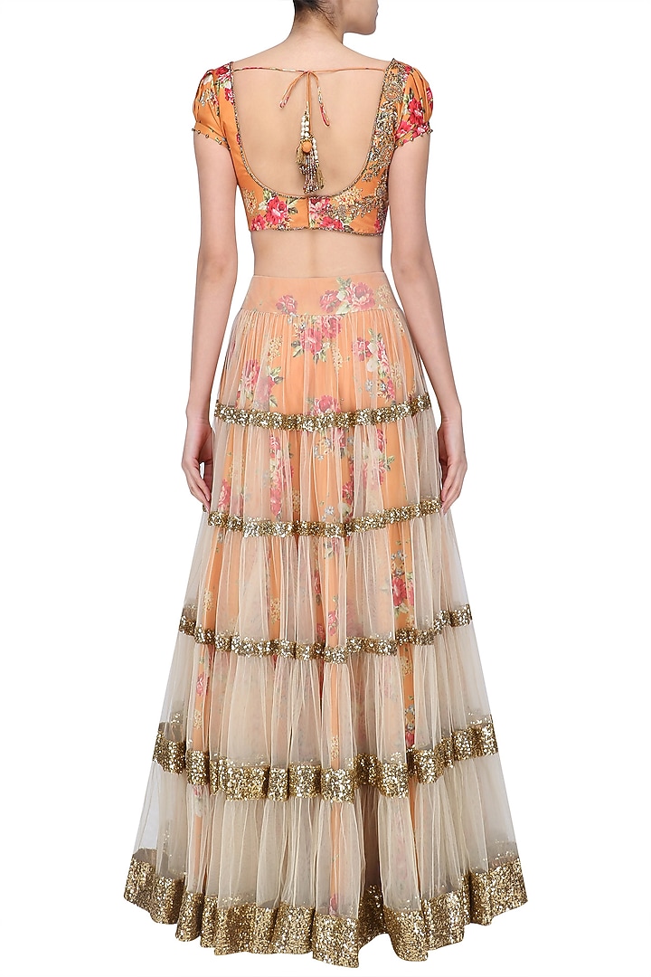 Beige lehenga skirt and orange floral embroidered blouse set available only at Pernia's Pop Up Shop.