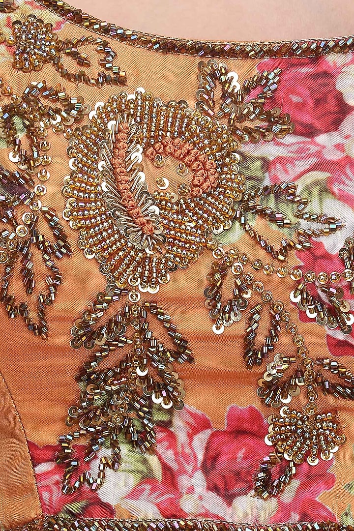 Beige lehenga skirt and orange floral embroidered blouse set available only at Pernia's Pop Up Shop.