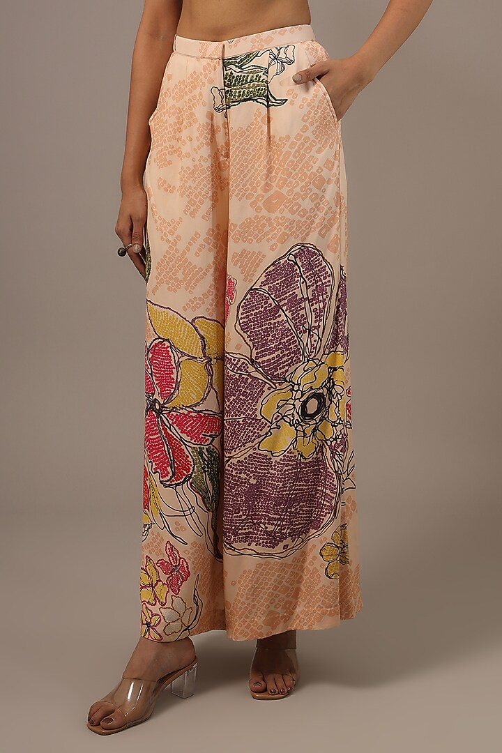 Peach Satin Bandhani Printed Palazzo Pants by Saaksha & Kinni at Pernia's Pop Up Shop