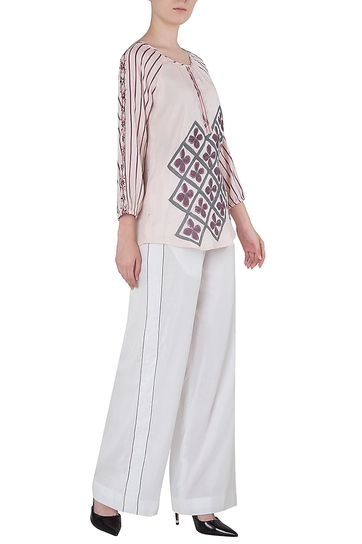 White contrast stitch palazzo pants available only at Pernia's Pop Up Shop.