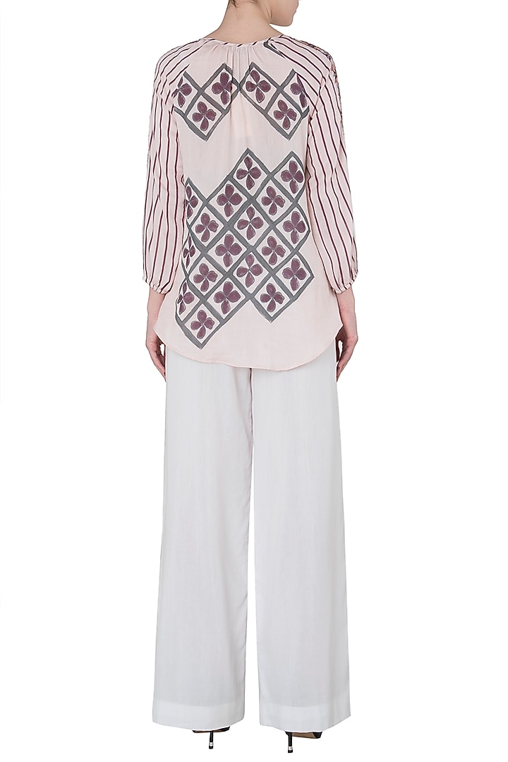 White contrast stitch palazzo pants available only at Pernia's Pop Up Shop.