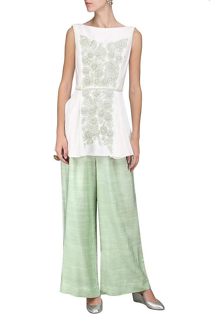 Ivory embroidered peplum top with palazzo pants available only at Pernia's Pop Up Shop.