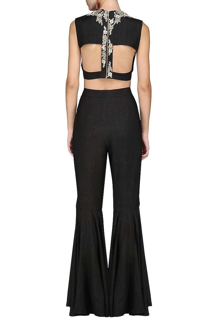 Black embroidered crop top with flared pants available only at Pernia's Pop Up Shop.