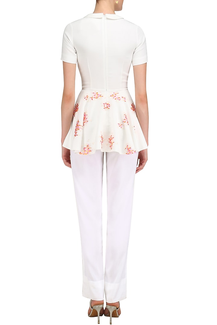 Ivory embroidered peplum top available only at Pernia's Pop Up Shop.