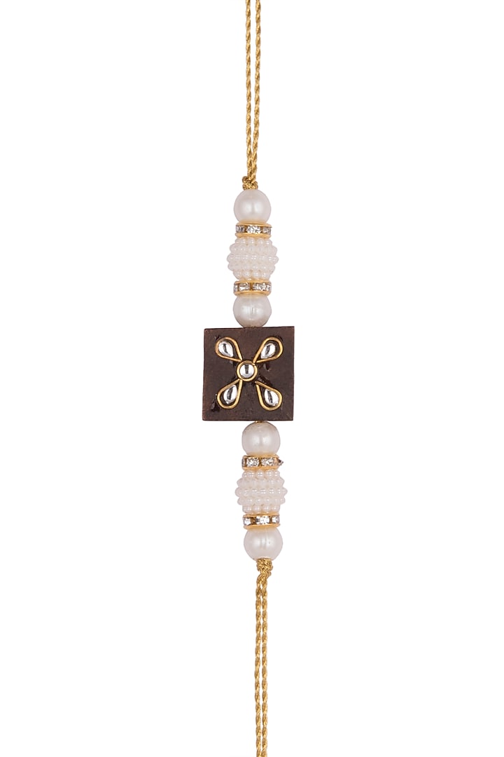 Gold Finish Embellished Rakhi by SONNET at Pernia's Pop Up Shop