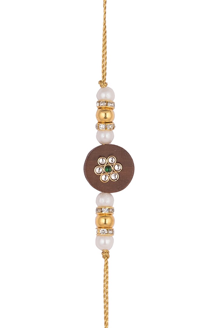 Gold Finish Pearl Rakhi by SONNET at Pernia's Pop Up Shop