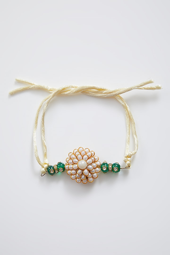 Gold Finish Floral Rakhi & Lumba Set by Sonnet at Pernia's Pop Up Shop