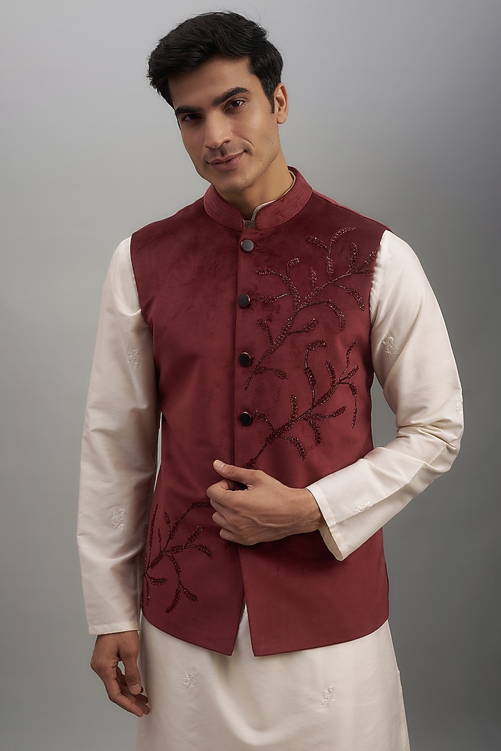 Maroon Suede Velvet Embroidered Bundi Jacket by SUHAIL HAFEEZ at Pernia's Pop Up Shop