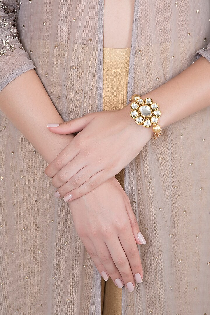 Matte Gold Finish Peach Crystal & Kundan Flower Adjustable Bracelet by Shillpa Purii at Pernia's Pop Up Shop