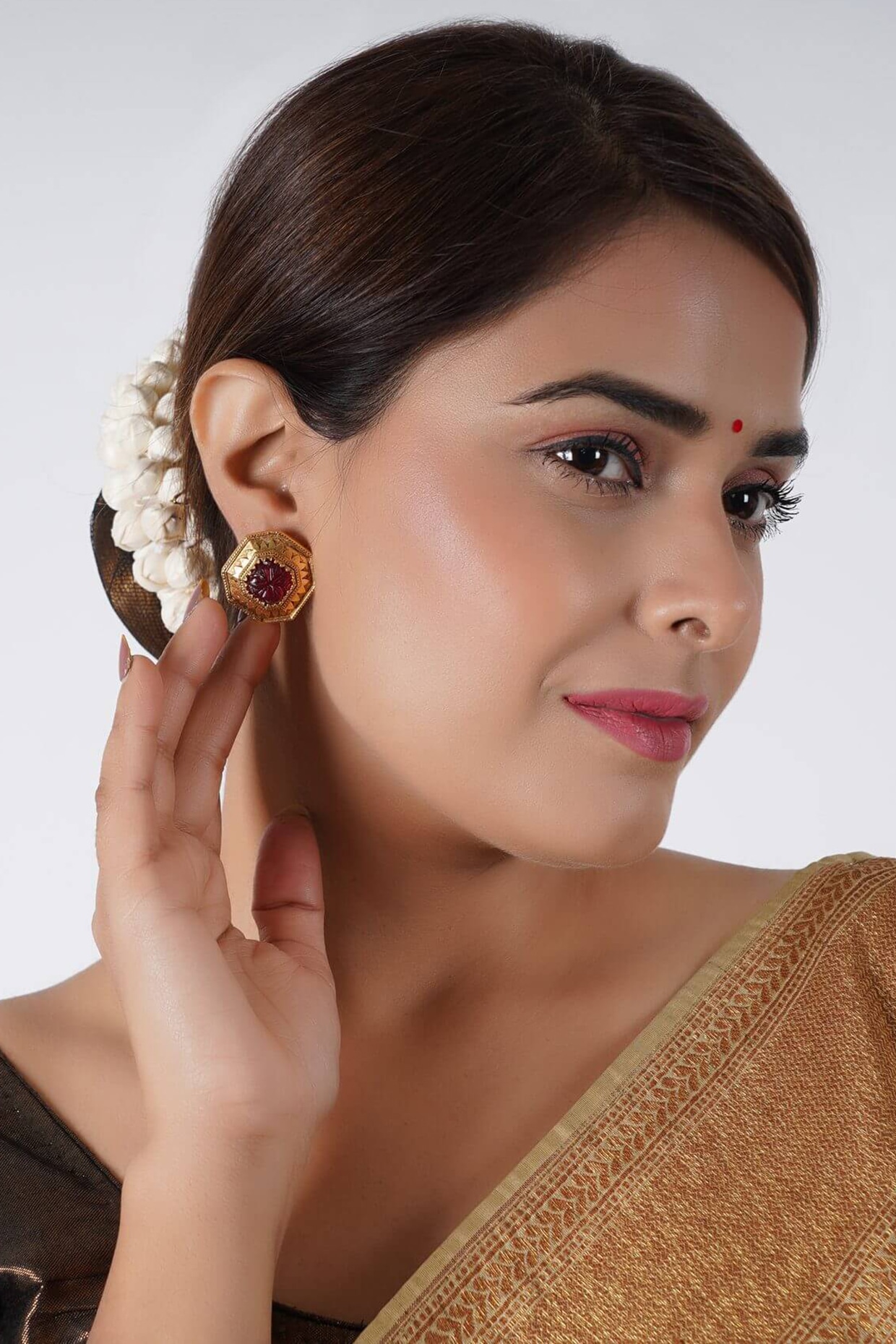 Gold earrings deals with ruby stone