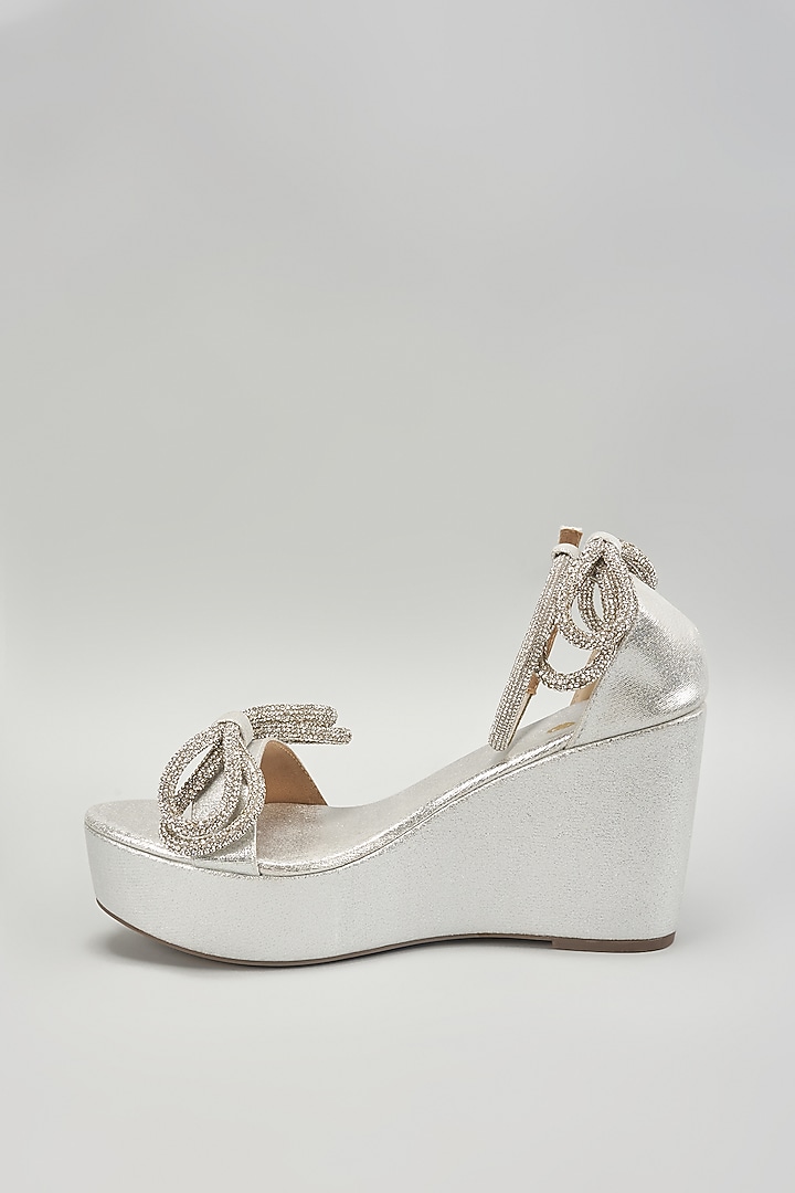 Silver Synthetic Leather Rhinestone Embellished Bow Wedges by Sana K Luxurious Footwear at Pernia's Pop Up Shop