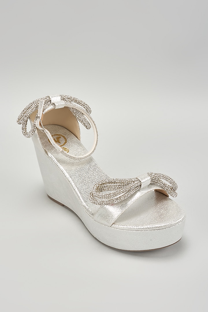 Silver Synthetic Leather Rhinestone Embellished Bow Wedges by Sana K Luxurious Footwear at Pernia's Pop Up Shop