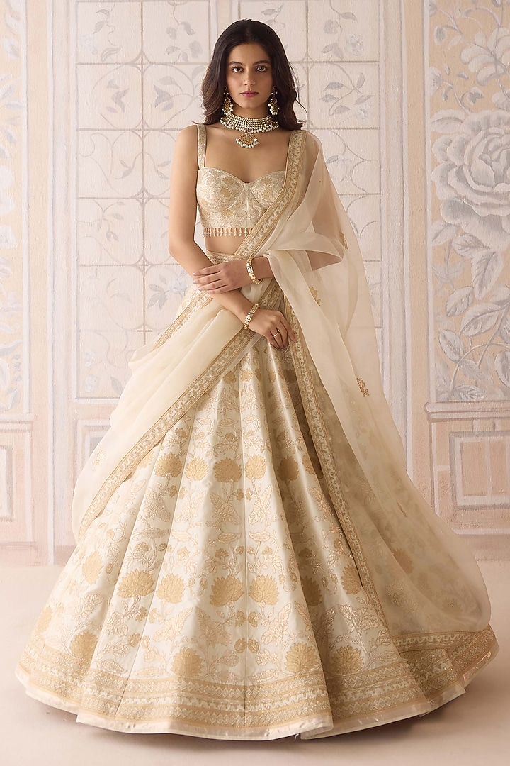 Ivory Raw Silk Applique Embroidered Wedding Lehenga Set by Shyam Narayan Prasad at Pernia's Pop Up Shop