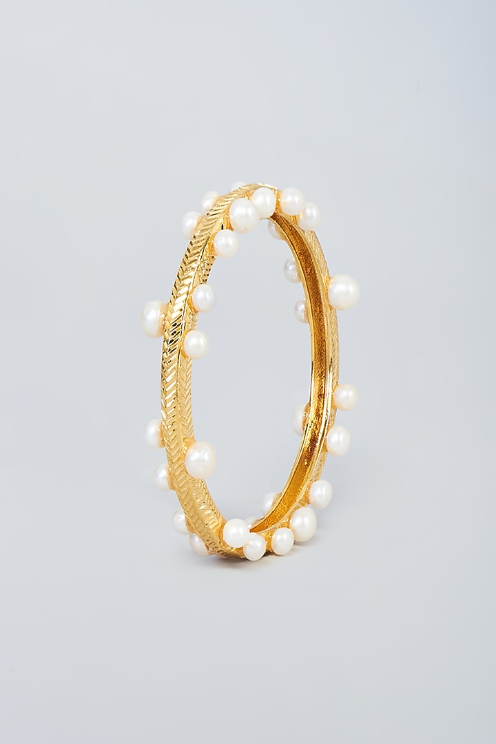Gold Plated Pearl Bangle in Sterling Silver by Sneha Rateria at Pernia's Pop Up Shop
