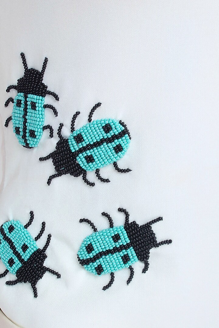 Separmint beetle motifs sleek bodysuit available only at Pernia's Pop Up Shop.
