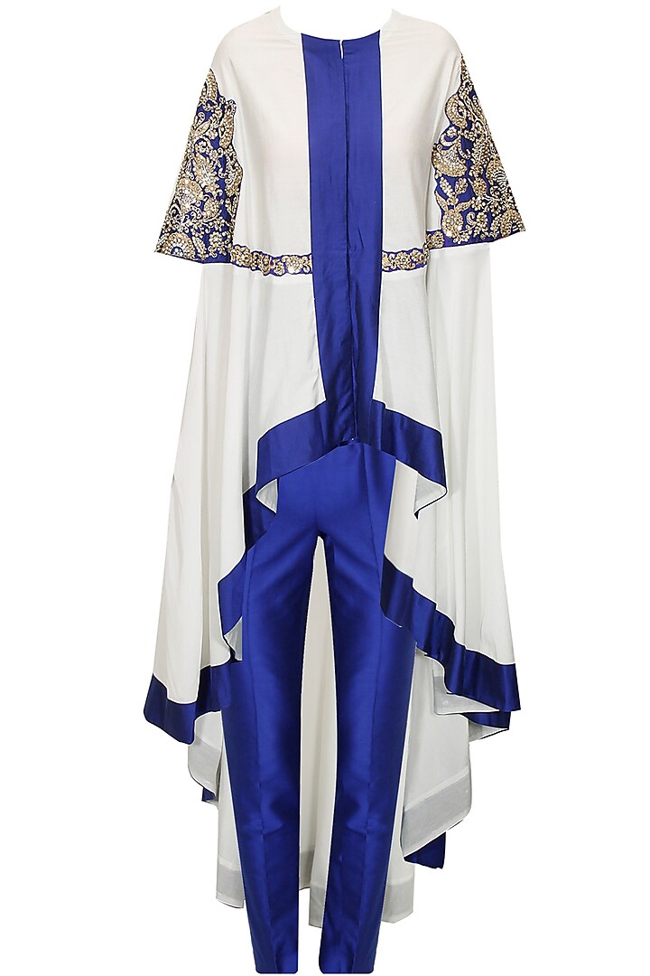 White and blue embroidered cape with blue pants by Sonali Gupta