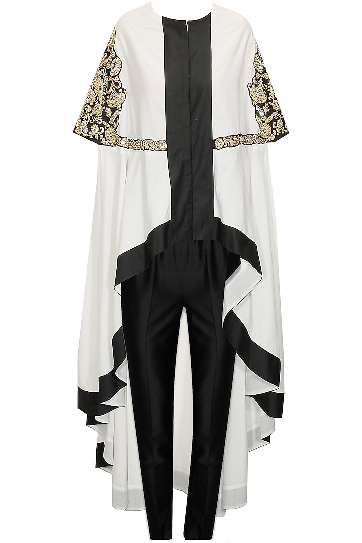 White and black embroidered cape with black pants by Sonali Gupta