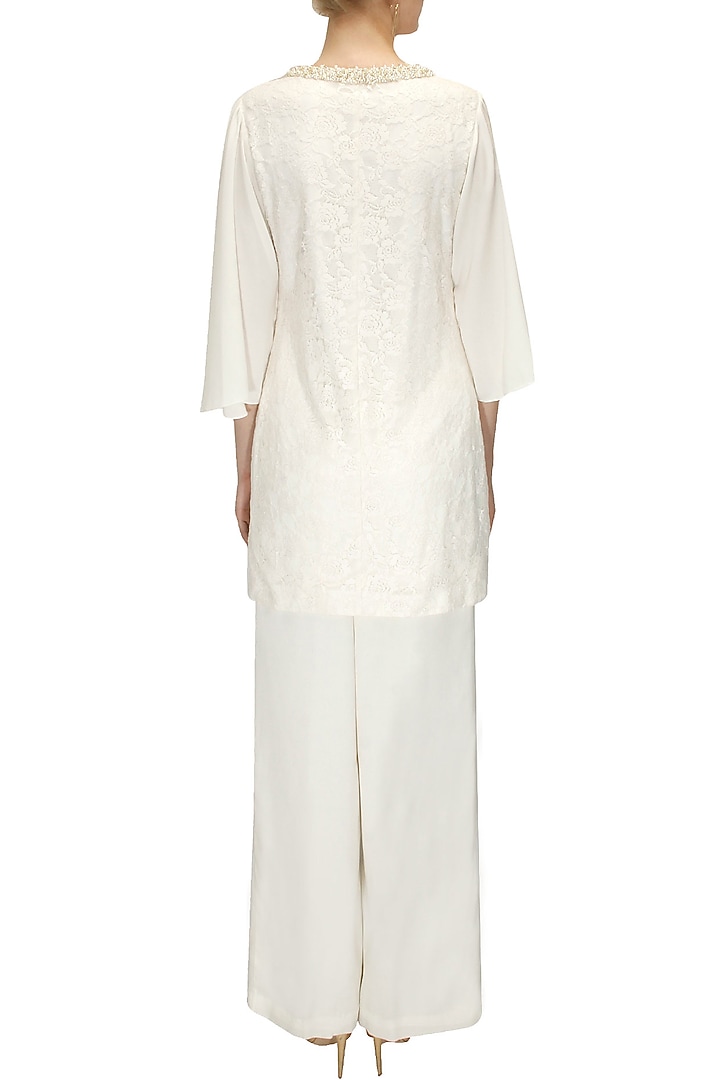 Off white pearl embellished tunic and palazzos available only at Pernia's Pop-Up Shop.