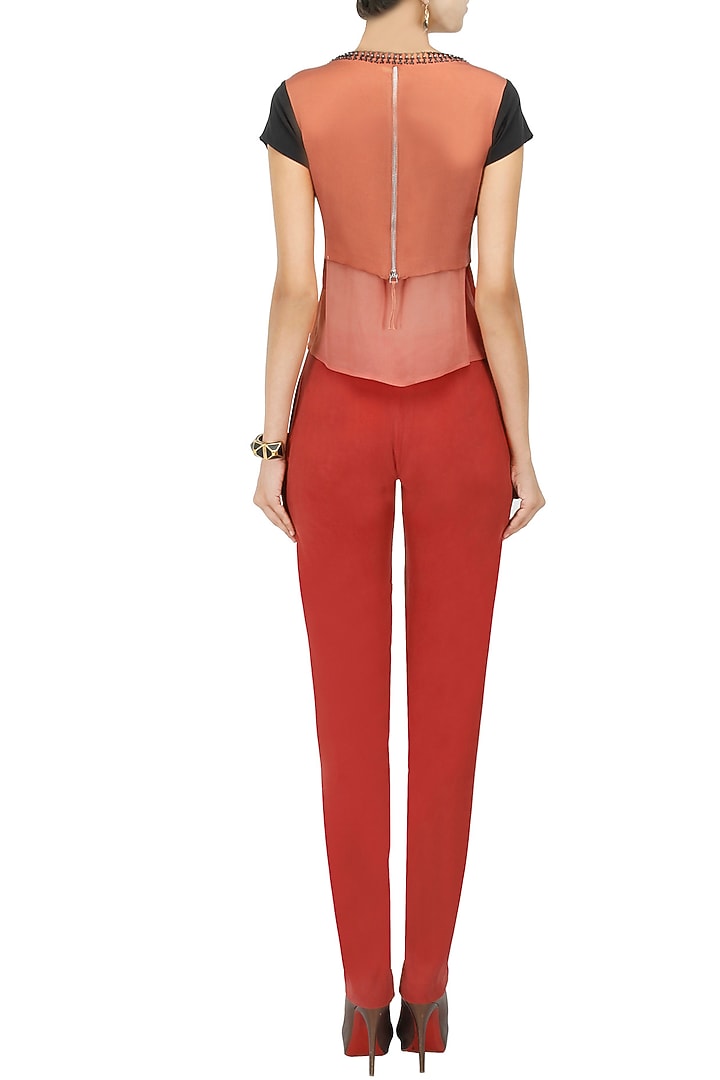 Red silk twill pleated trousers available only at Pernia's Pop-Up Shop.