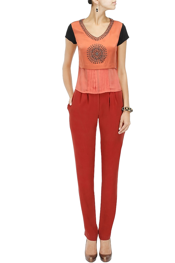 Red silk twill pleated trousers available only at Pernia's Pop-Up Shop.