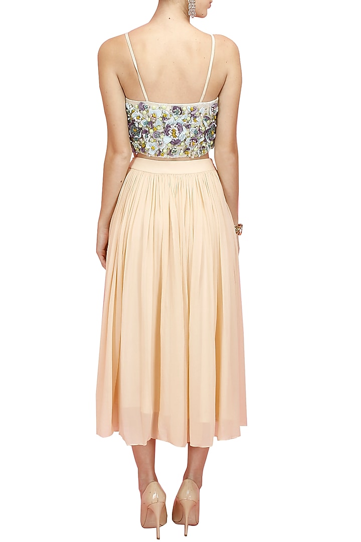 Multicolour floral embroidered bustier with peach flared skirt available only at Pernia's Pop-Up Shop.