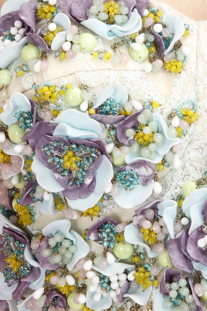 Multicolour floral embroidered bustier with peach flared skirt available only at Pernia's Pop-Up Shop.