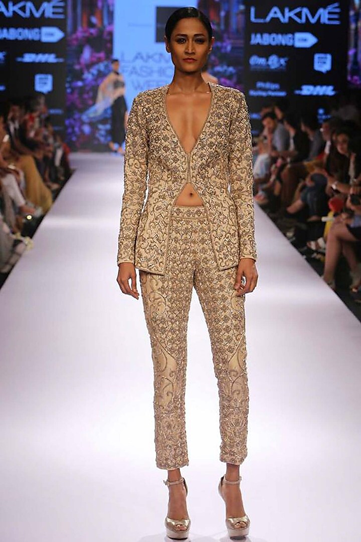 Champagne gold zardozi embroidered blazer pants set by Sonaakshi Raaj