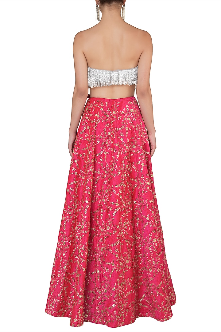 Grey embellished bustier with hot pink lehenga skirt set available only at Pernia's Pop Up Shop.