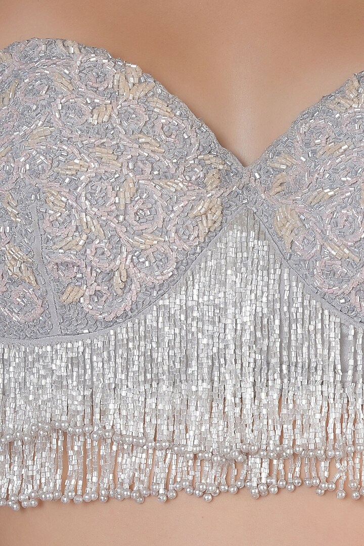 Grey embellished bustier with hot pink lehenga skirt set available only at Pernia's Pop Up Shop.