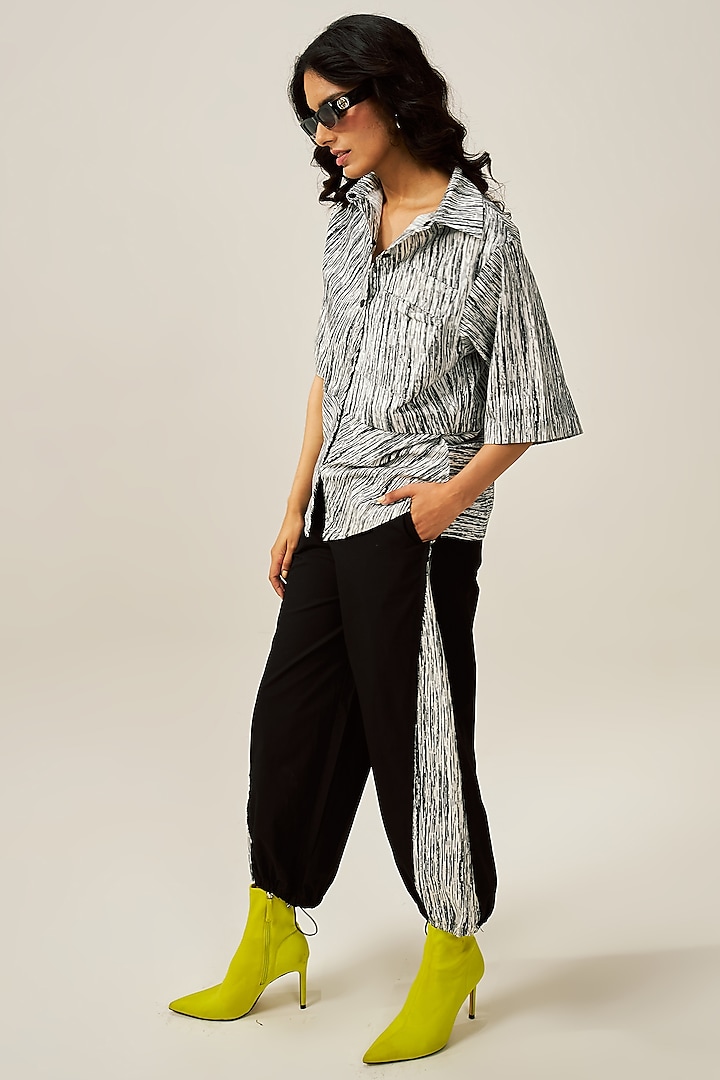 Black Natural Cotton Poplin Carrot-Fit Track Pants by Spacelines at Pernia's Pop Up Shop