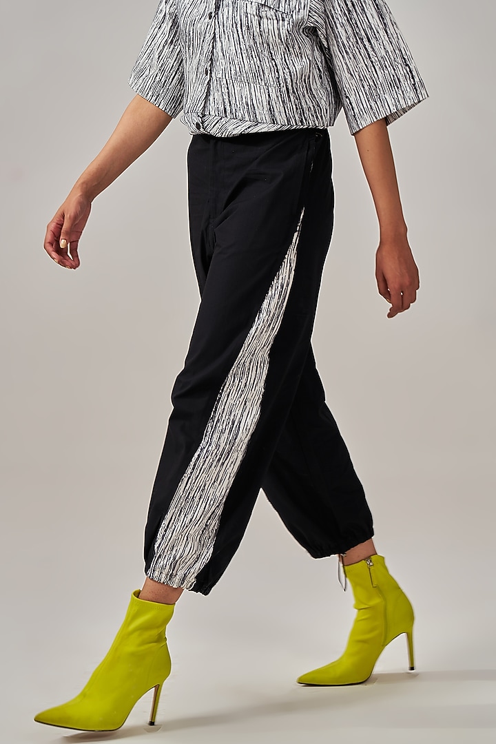 Black Natural Cotton Poplin Carrot-Fit Track Pants by Spacelines at Pernia's Pop Up Shop