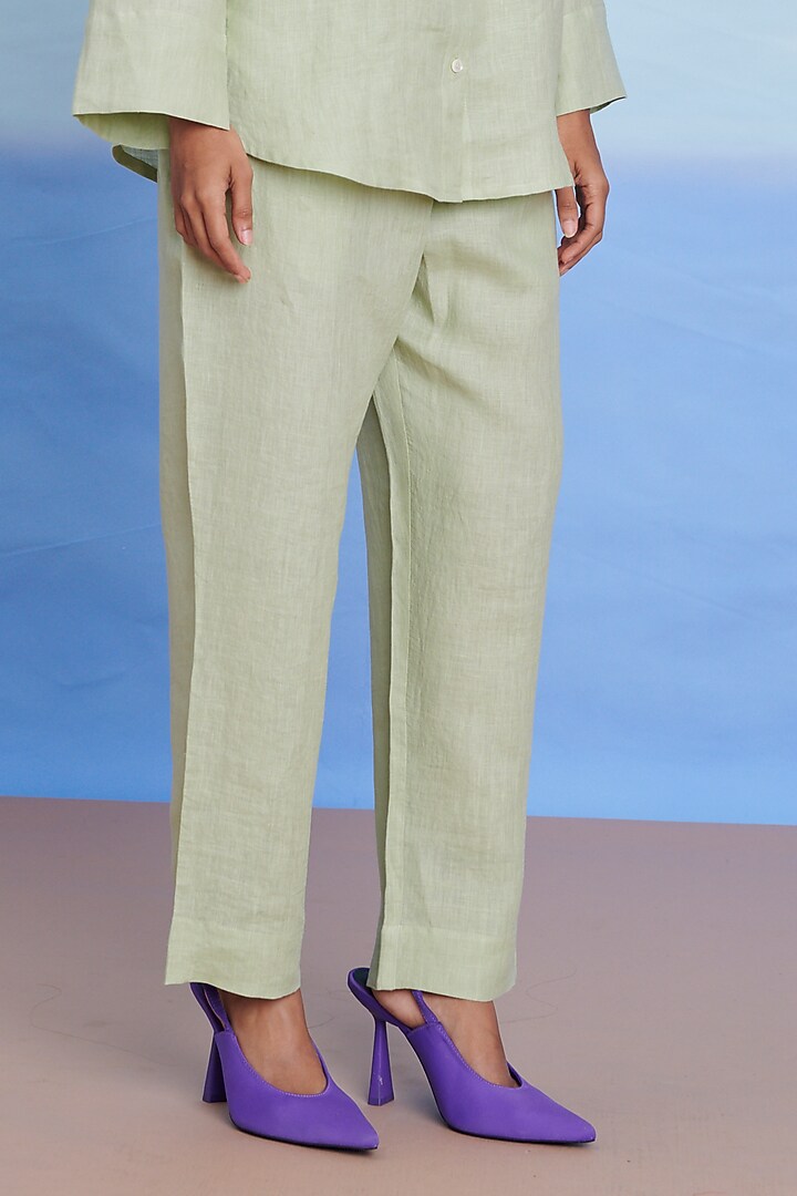 Pista Green Linen Pleated Pants by Saphed at Pernia's Pop Up Shop