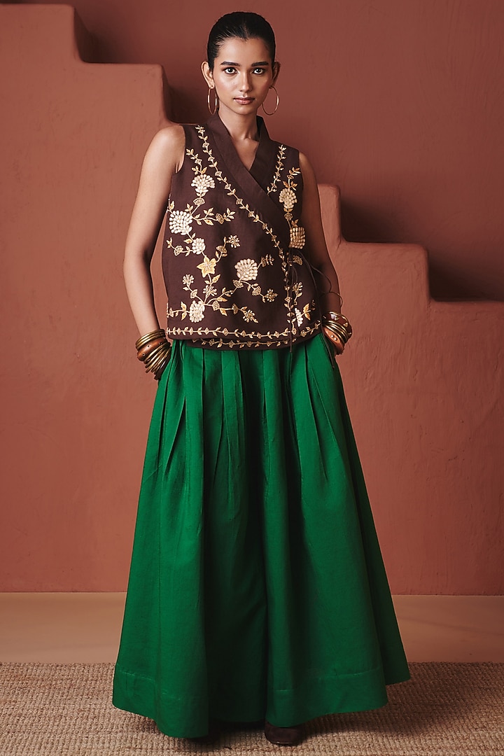 Green Cotton Linen Pleated Flared Pants by Saphed at Pernia's Pop Up Shop