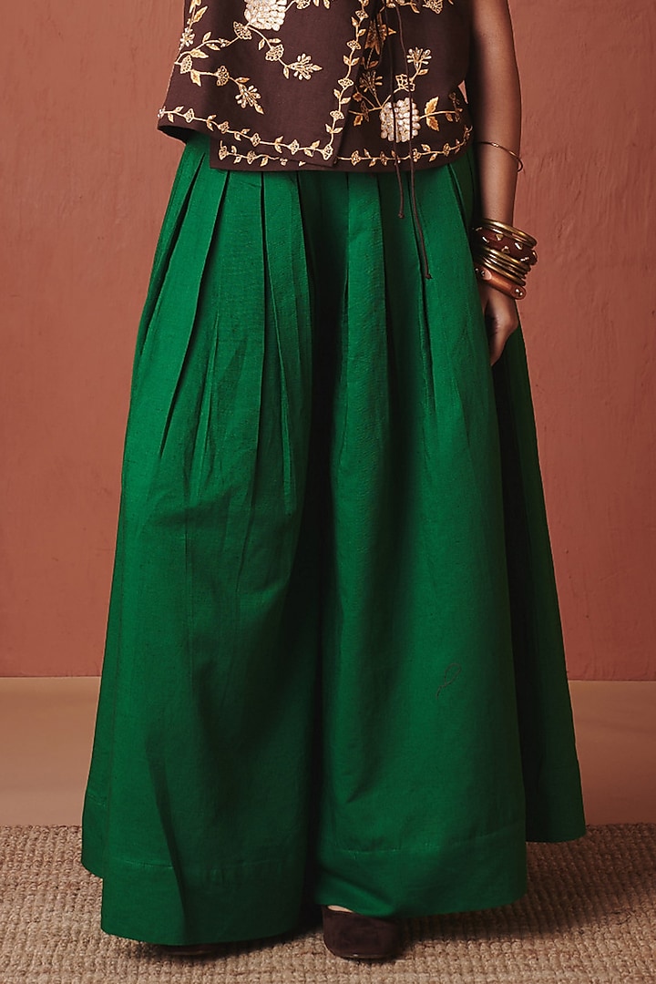 Green Pure Linen Pleated Flared Pants by Saphed at Pernia's Pop Up Shop