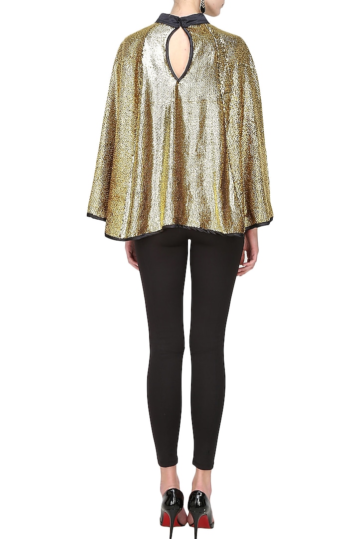 Bold gold sequin cape available only at Pernia's Pop Up Shop.