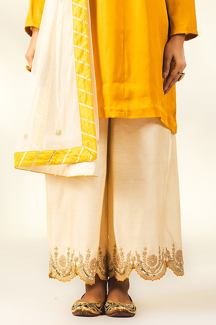 Mustard Crepe Silk Dori & Thread Embroidered Short Kurta Set by Shivani Sabharwal at Pernia's Pop Up Shop