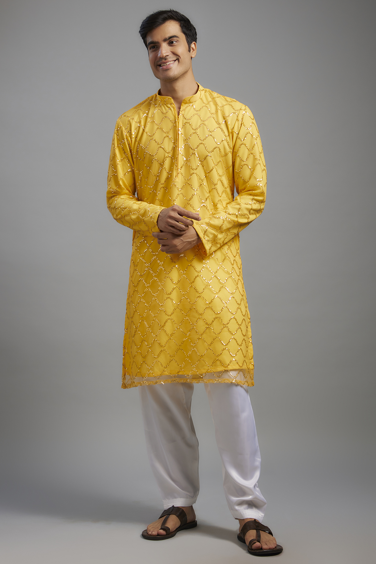 Yellow Net Sequins Embroidered Kurta Set by SVEN SUITS