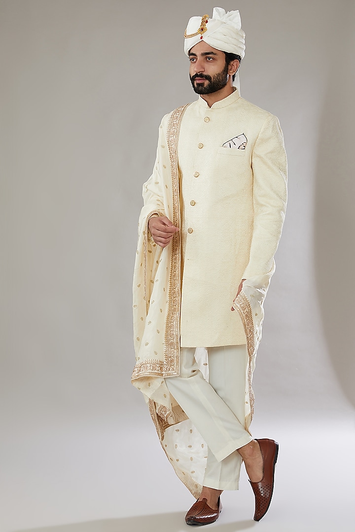 Ivory Raw Silk Embroidered Groom Sherwani Set by SVEN SUITS at Pernia's Pop Up Shop