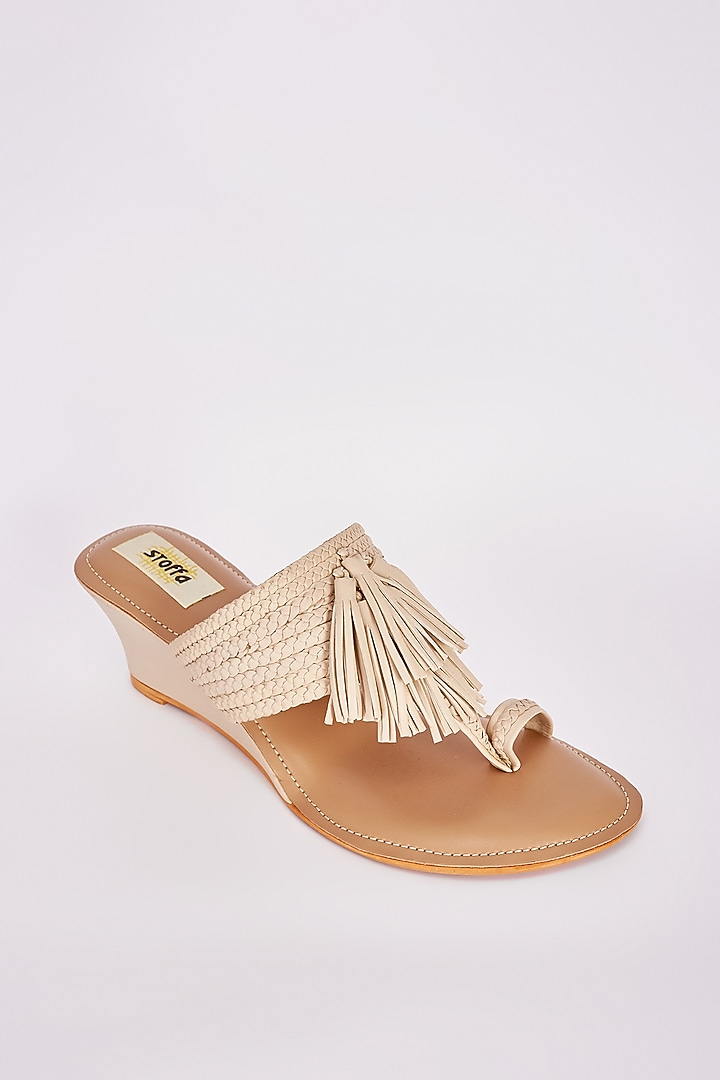 Beige Faux Leather Tasseled Wedges by Stoffa Bride at Pernia's Pop Up Shop