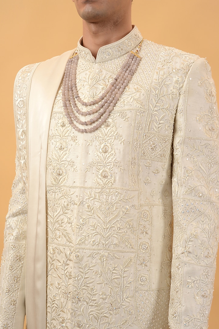 Off-White Raw Silk Hand & Machine Embroidered Groom Sherwani Set by STEEL at Pernia's Pop Up Shop