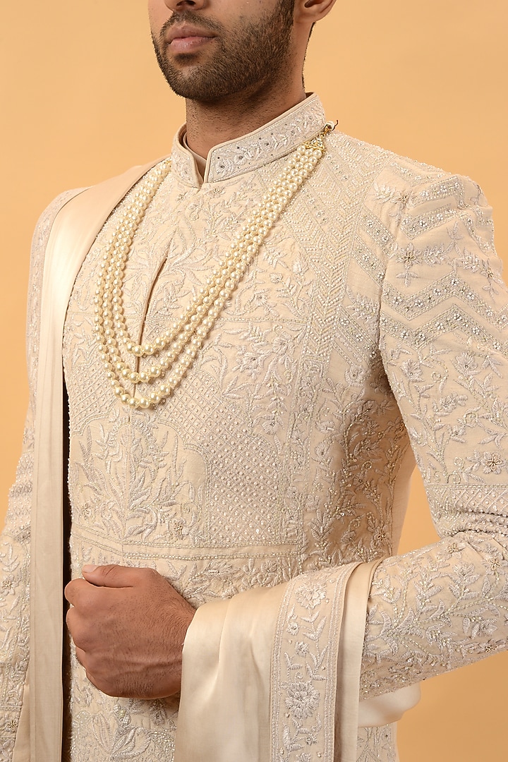 Beige Raw Silk Hand & Machine Embroidered Groom Sherwani Set by STEEL at Pernia's Pop Up Shop