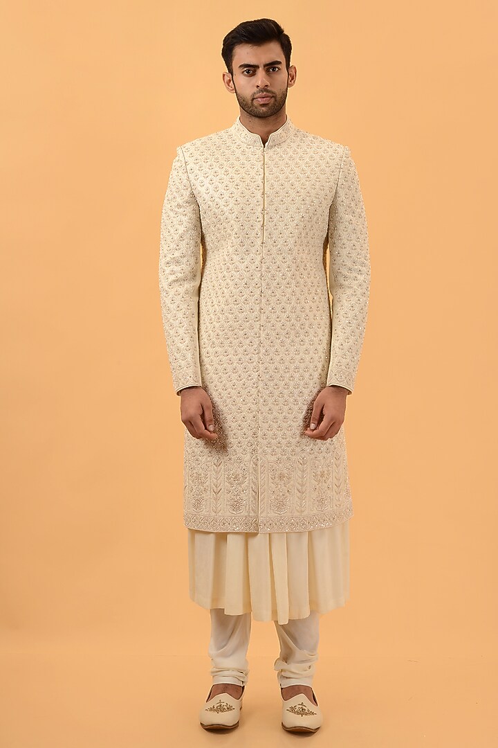 Cream Raw Silk Hand & Machine Embroidered Groom Sherwani Set by STEEL at Pernia's Pop Up Shop