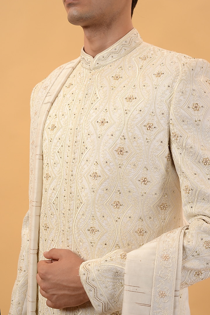 Cream Raw Silk Machine & Hand Embroidered Wedding Sherwani Set by STEEL at Pernia's Pop Up Shop