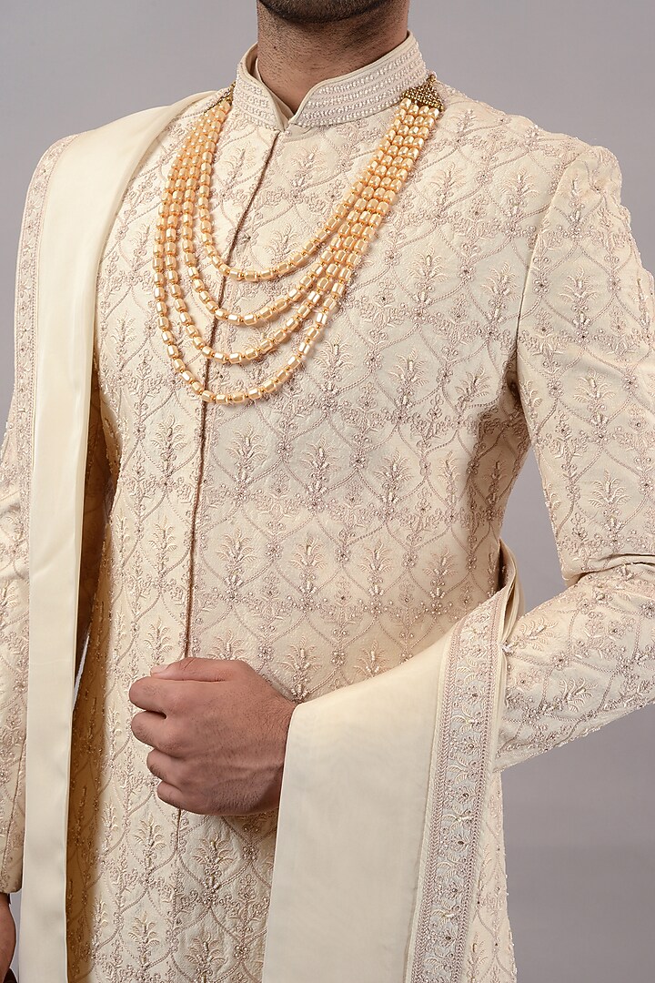 Beige Raw Silk Machine & Hand Embroidered Wedding Sherwani Set by STEEL at Pernia's Pop Up Shop