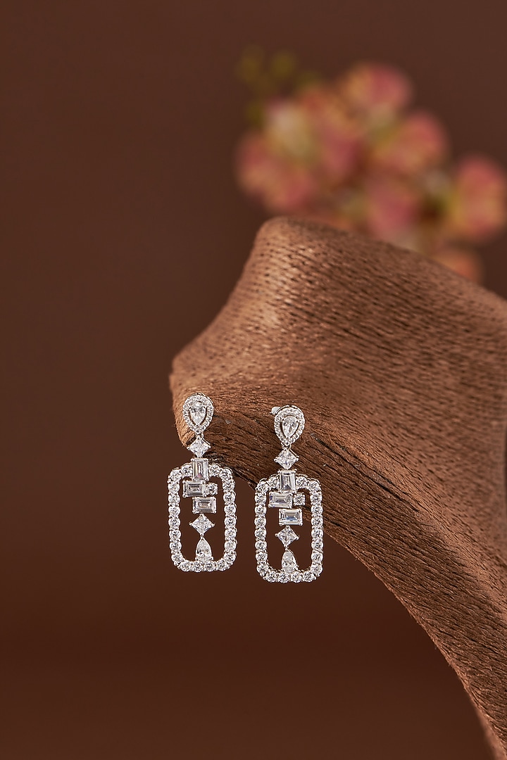 White Finish Zircon Dangler Earrings In Sterling Silver by STELLA CREATIONS at Pernia's Pop Up Shop