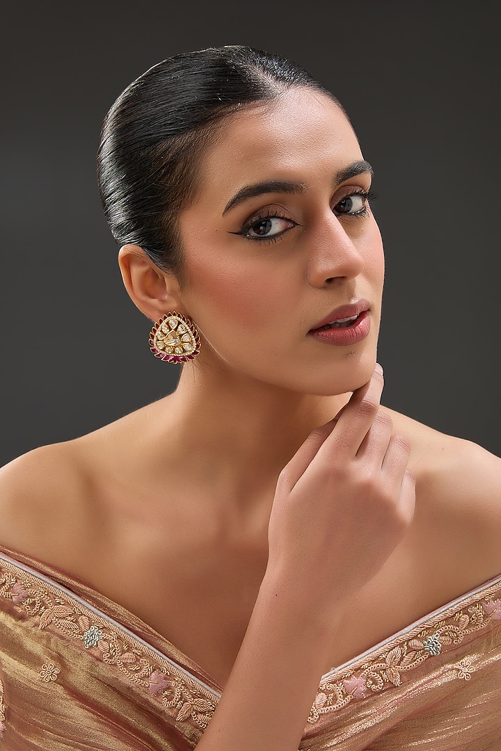 Gold Finish Moissanite Polki & Synthetic Ruby Stone Stud Earrings In Sterling Silver by STELLA CREATIONS at Pernia's Pop Up Shop