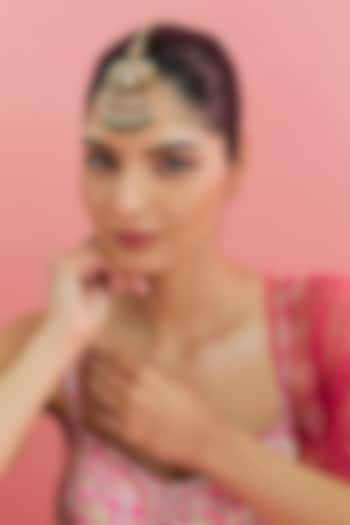 Yellow Gold Finish Moissanite Polki & Emerald Maangtikka In Sterling Silver by STELLA CREATIONS at Pernia's Pop Up Shop