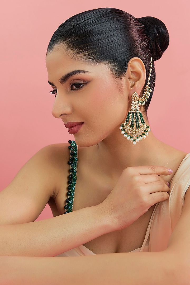 Yellow Gold Finish Eurostar Swarovski & Emerald Dangler Earrings In Sterling Silver by STELLA CREATIONS at Pernia's Pop Up Shop