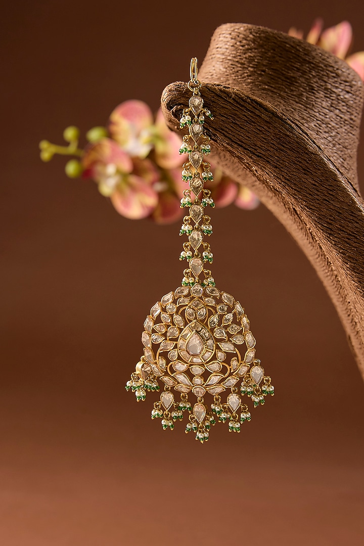 Gold Finish Kundan Polki & Emerald Stone Maangtikka In Sterling Silver by STELLA CREATIONS at Pernia's Pop Up Shop
