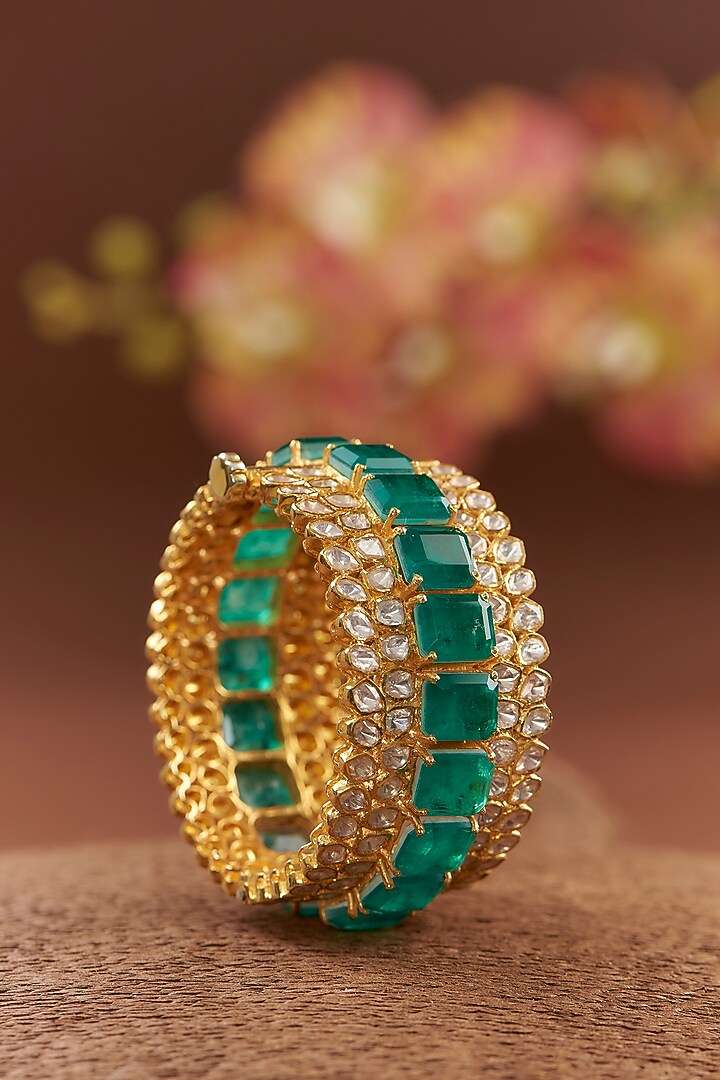 Gold Finish Moissanite Polki & Synthetic Emerald Bangle In Sterling Silver by STELLA CREATIONS at Pernia's Pop Up Shop